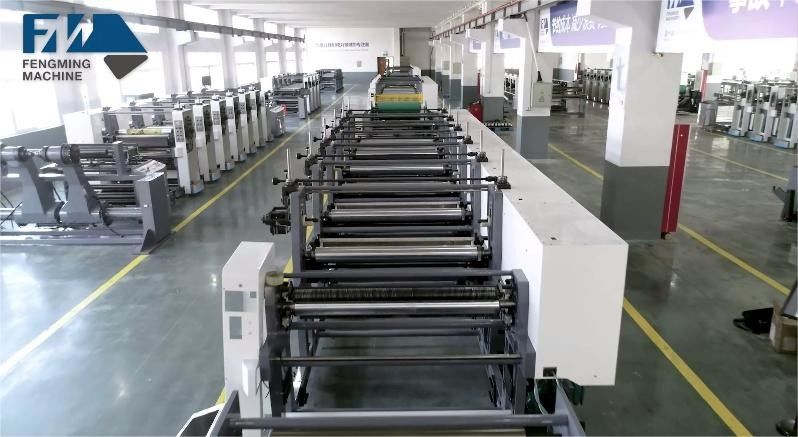 Sistema de guia web e carregamento/descarregamento automático para máquina de impressão de tipo unitário