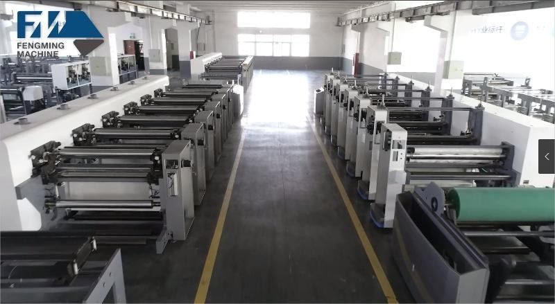 Sistema de guia web e carregamento/descarregamento automático para máquina de impressão de tipo unitário
